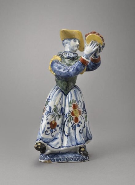 Delft figure playing the tambourine Delft figure playing the tambourine