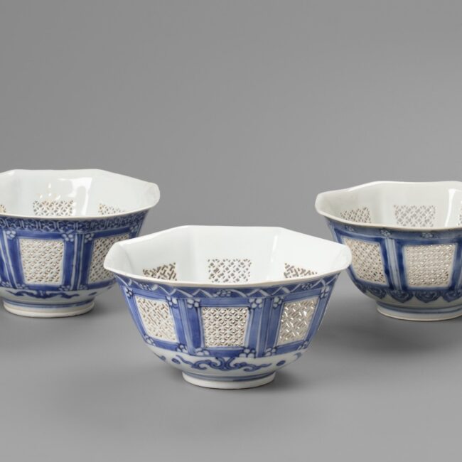 A set of three matching octagonal reticulated blue and white bowls