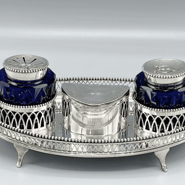 A rare pair of Dutch silver biscuit-boxes with mustache